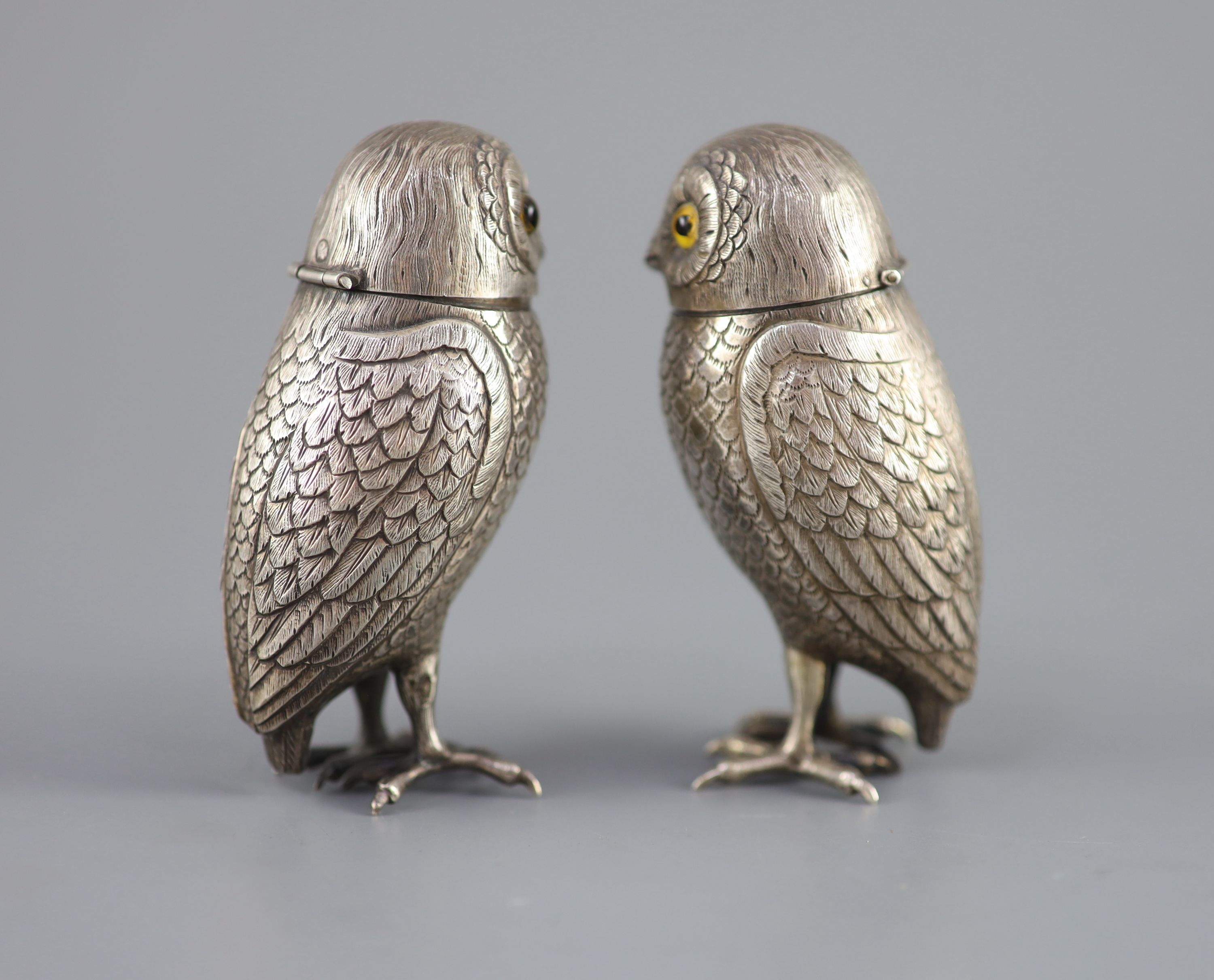 A pair of late 19th/early 20th century Dutch silver novelty pepperettes, modelled as owls